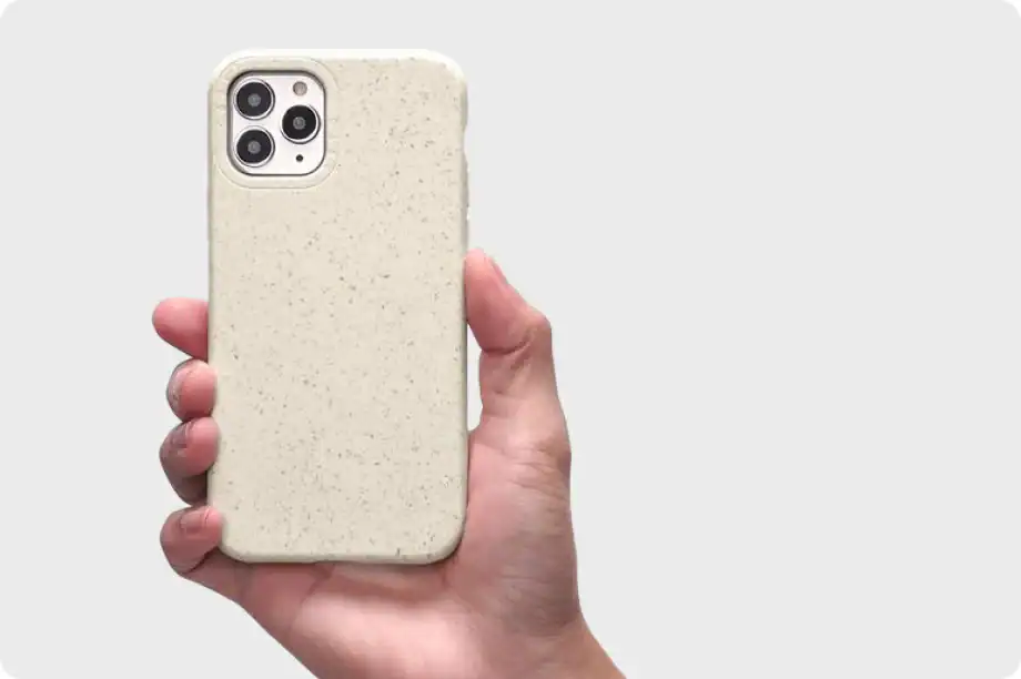 Cream-colored speckled phone case for iPhone, durable and stylish protection.