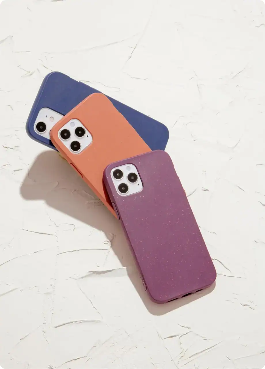 Colorful iPhone cases with glittery, matte, and textured finishes for various iPhone models.