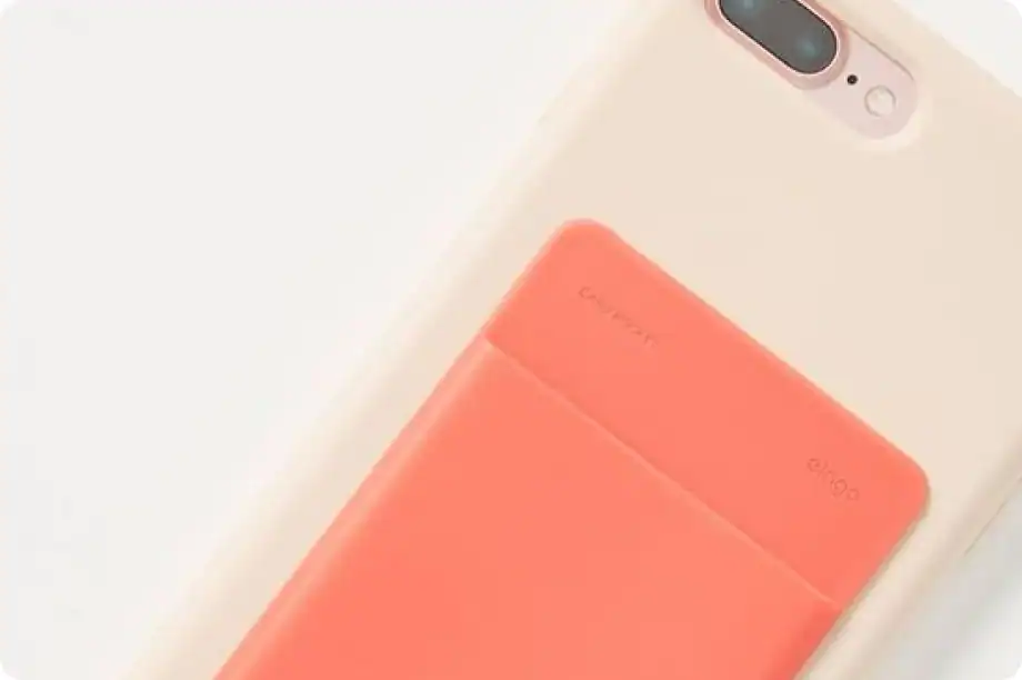 Bright coral mobile phone case with dual charging pads for seamless wireless charging.